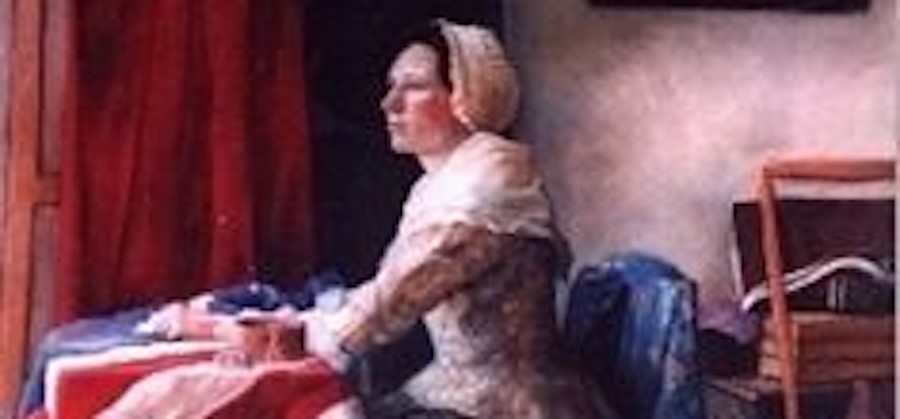 Betsy looking out the window with the American Flag